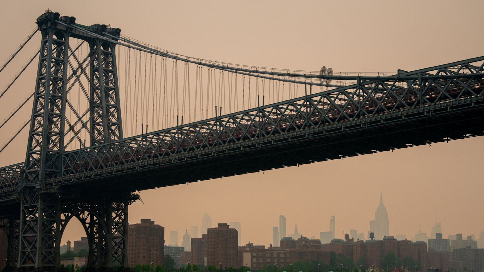 Wildfires force thousands to evacuate as smoke darkens skies over major cities